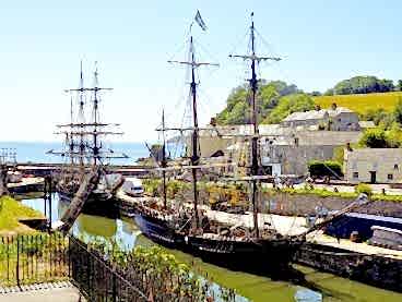 Tall ships anchored at Charlestown Harbour in Cornwall.