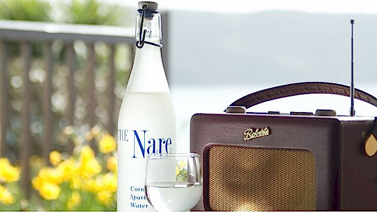 A bottle of water and a radio at The Nare hotel.