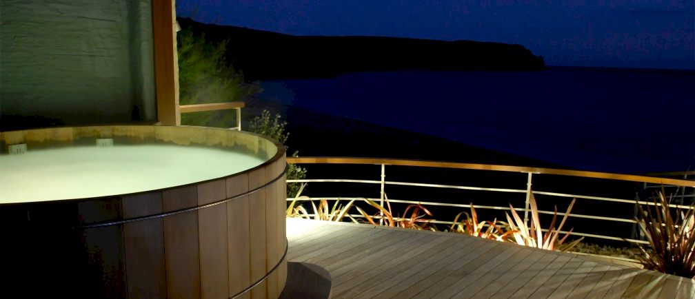 The Nare hotel's hot tub at night.