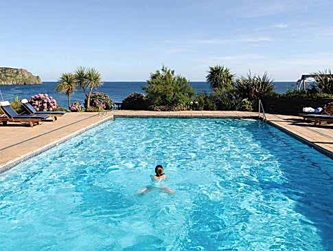 Someone swims in The Nare's outdoor pool.