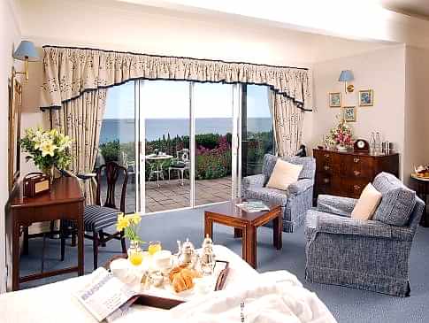 A room at The Nare hotel, with a view of the sea.