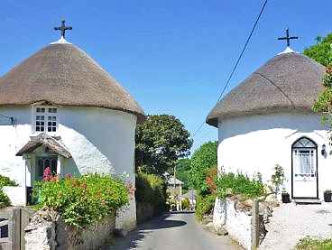 Thatched round houses in Veryan, Cornwall.